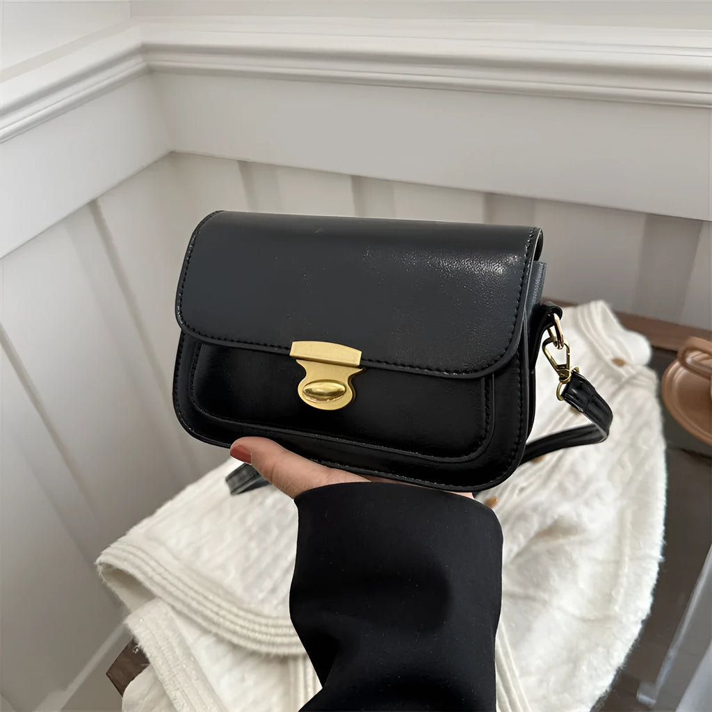 Retro-style small square handbag in soft brown PU leather with a horizontal silhouette.