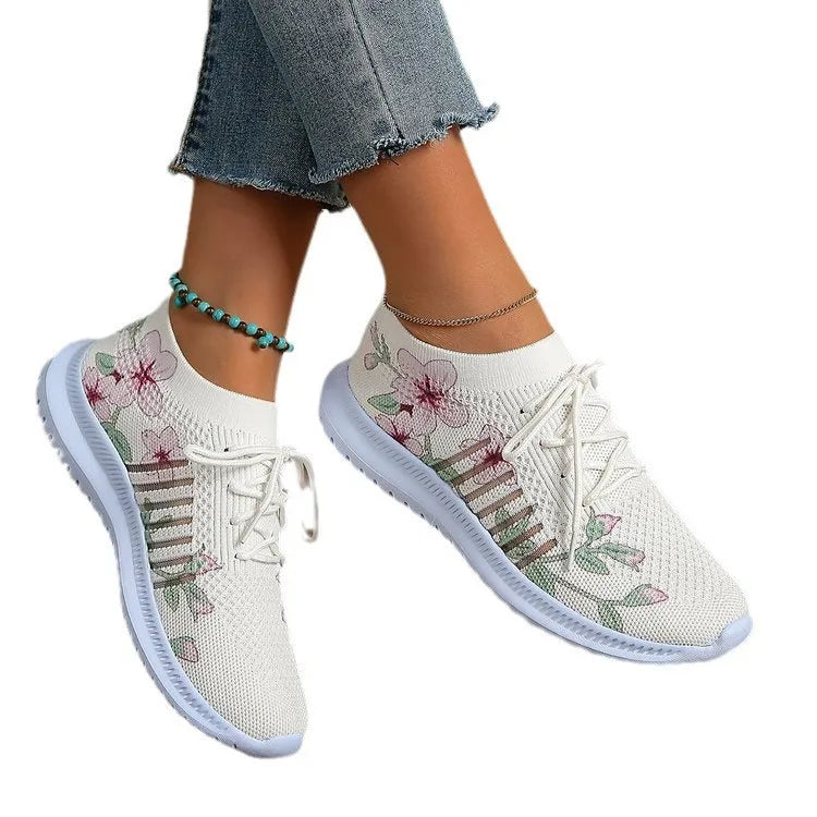 White women's mesh knit running shoes with round toe and flat rubber sole