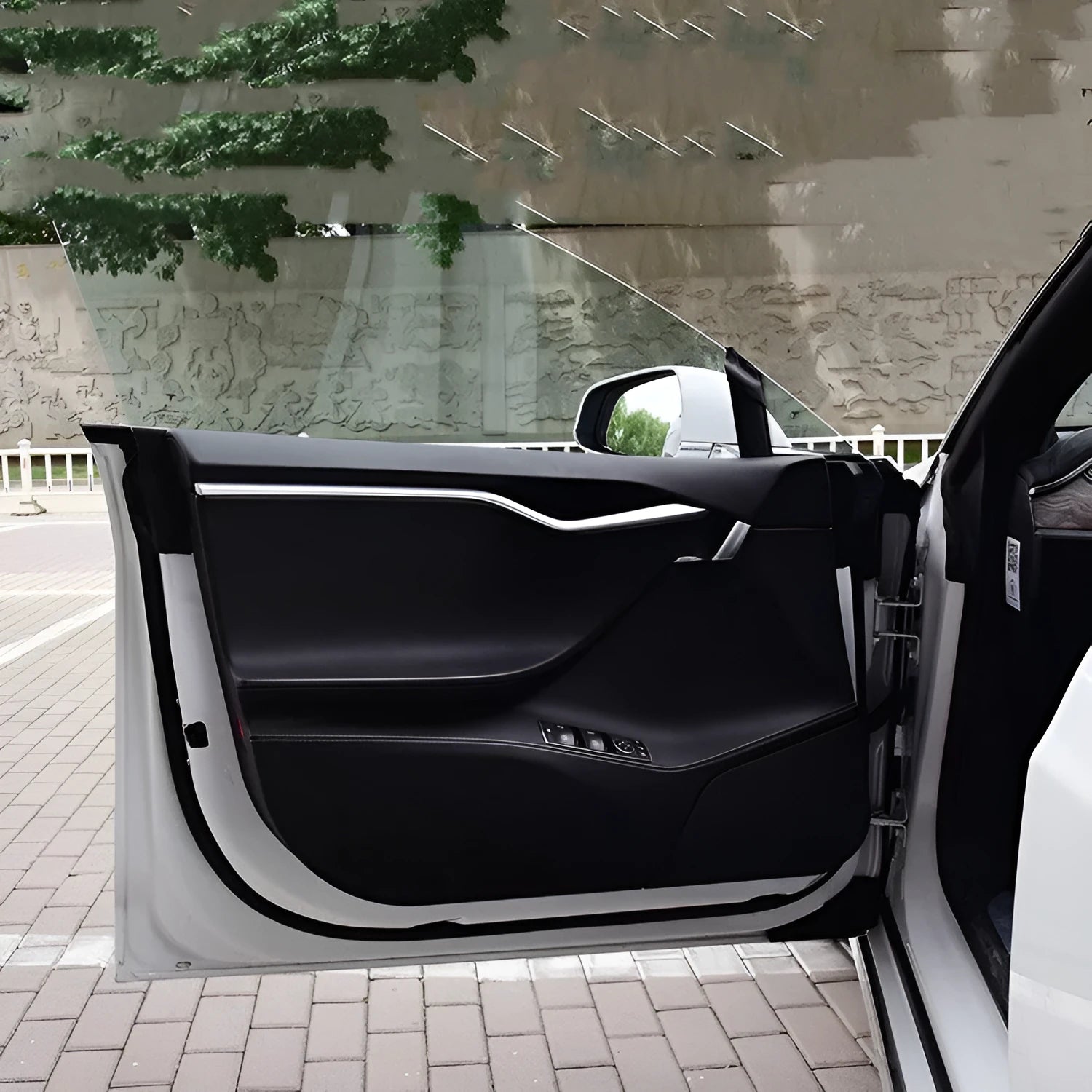 Four pre-cut carbon fibre protective films for Tesla Model S interior door control layouts.
