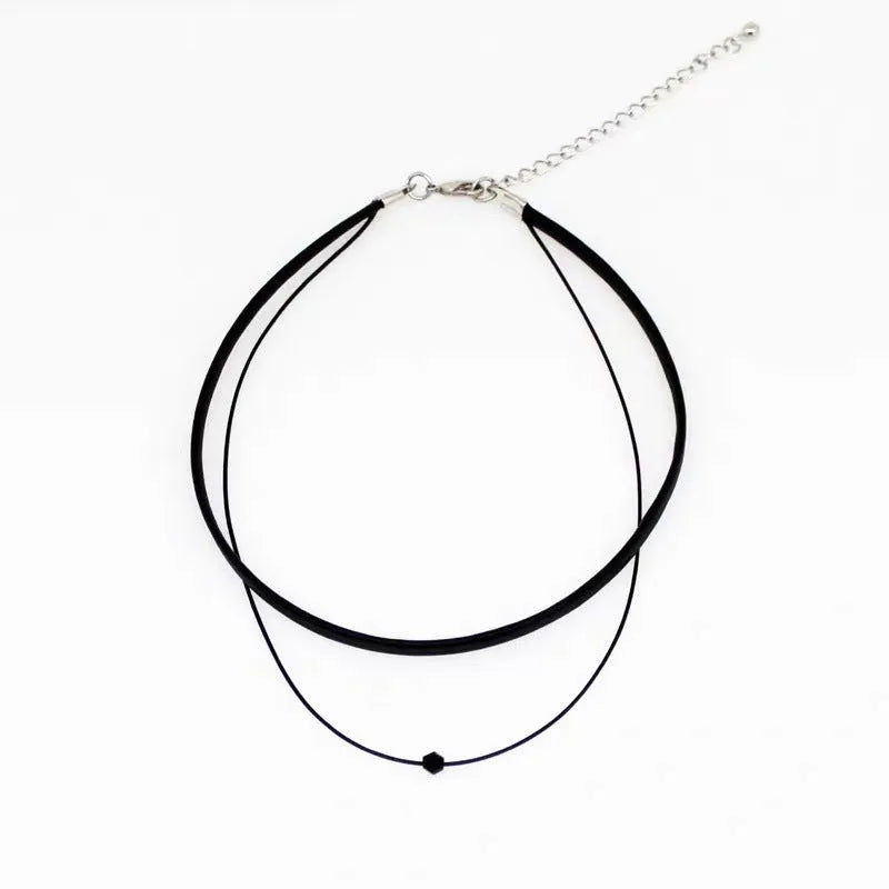 Retro leather rope double layer necklace with glass crystal beads and stainless steel buckle on a neutral background
