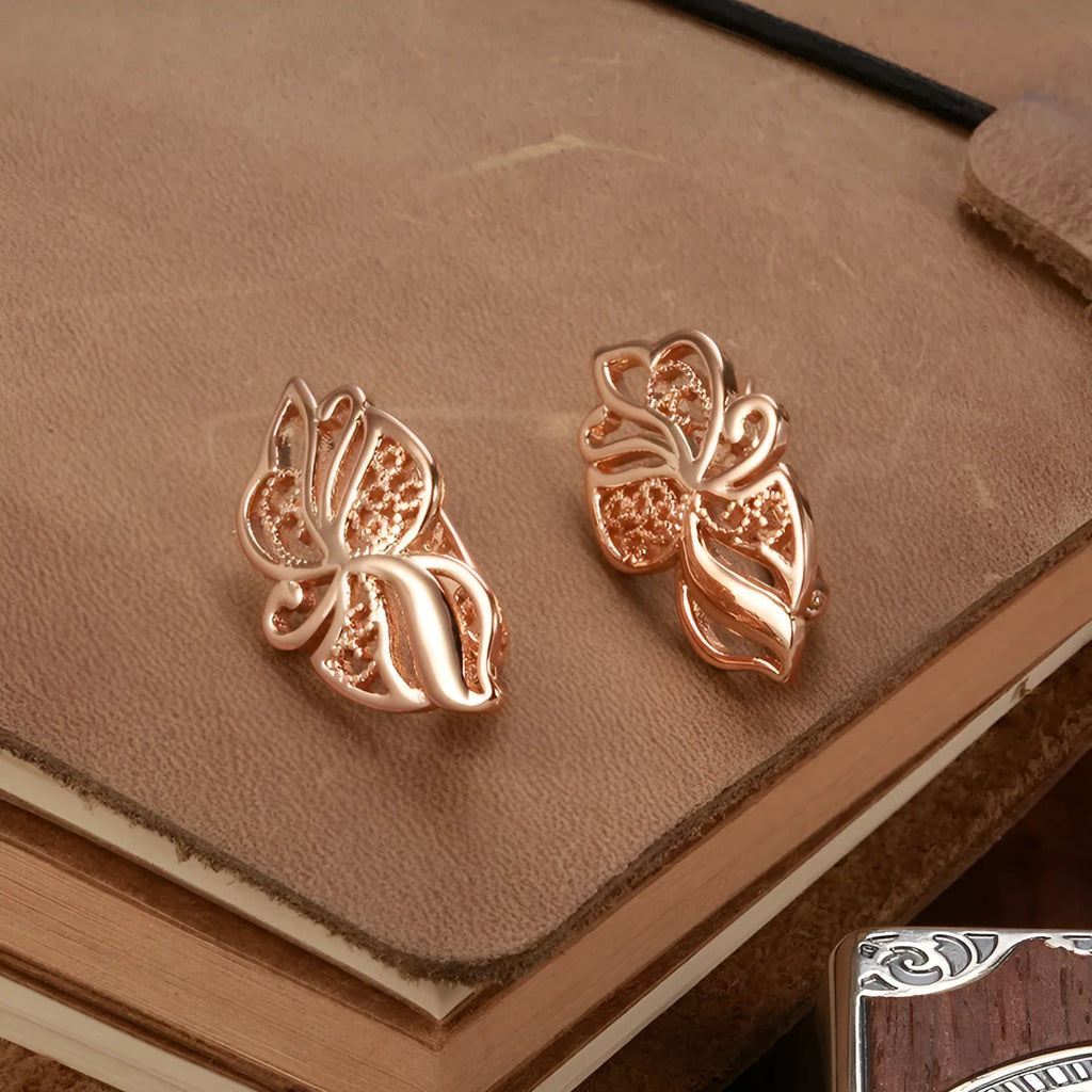 Rose gold geometric earrings for women with hollow carved copper design and rhinestone accents, one pair