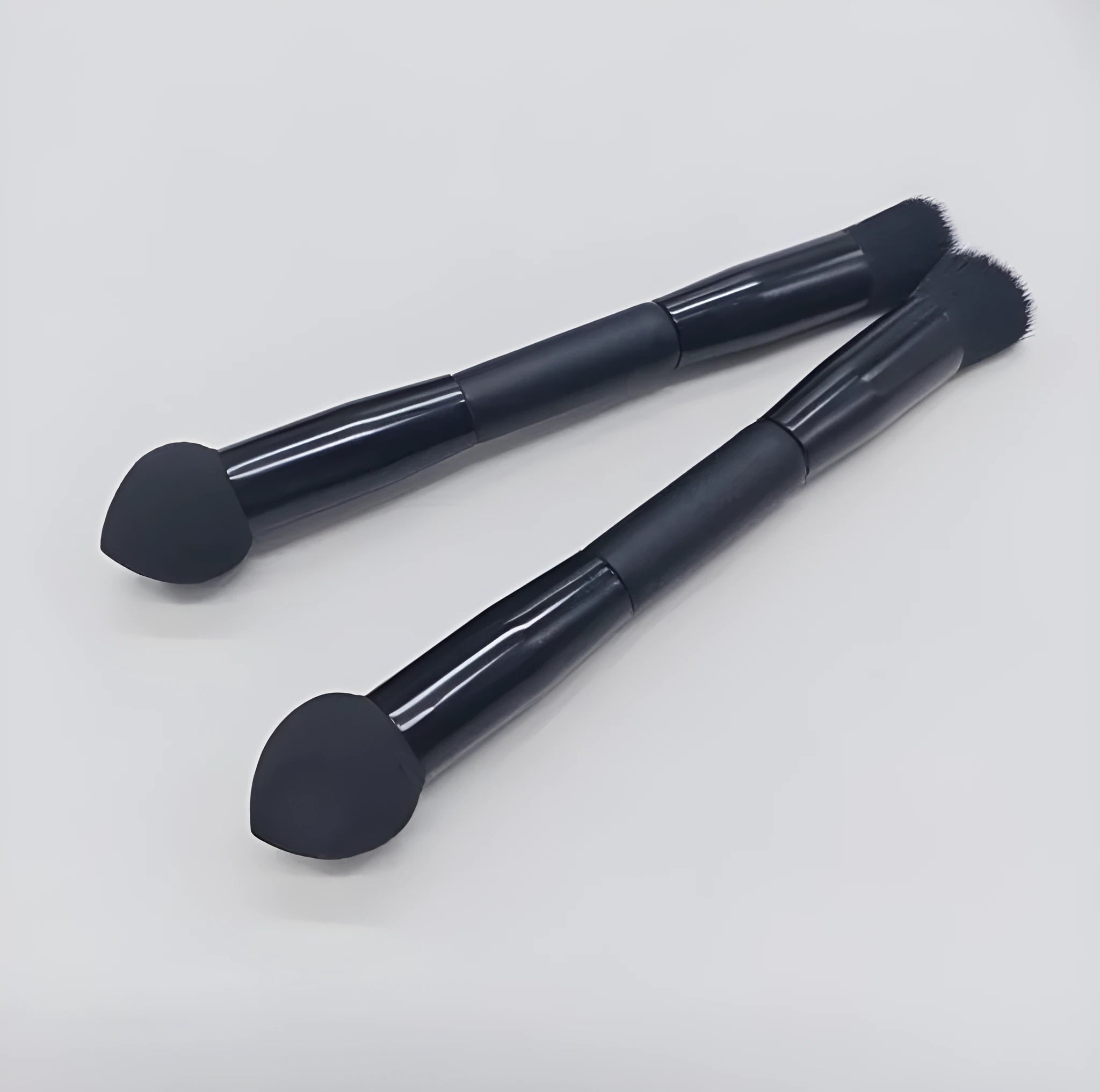 Double-headed miter sponge concealer makeup brush with black wooden handle