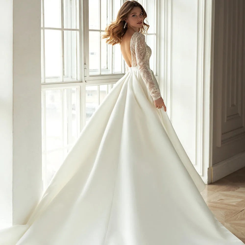 Women's long white polyester dress with gilded hollow-out detail, long sleeves, and full-length skirt