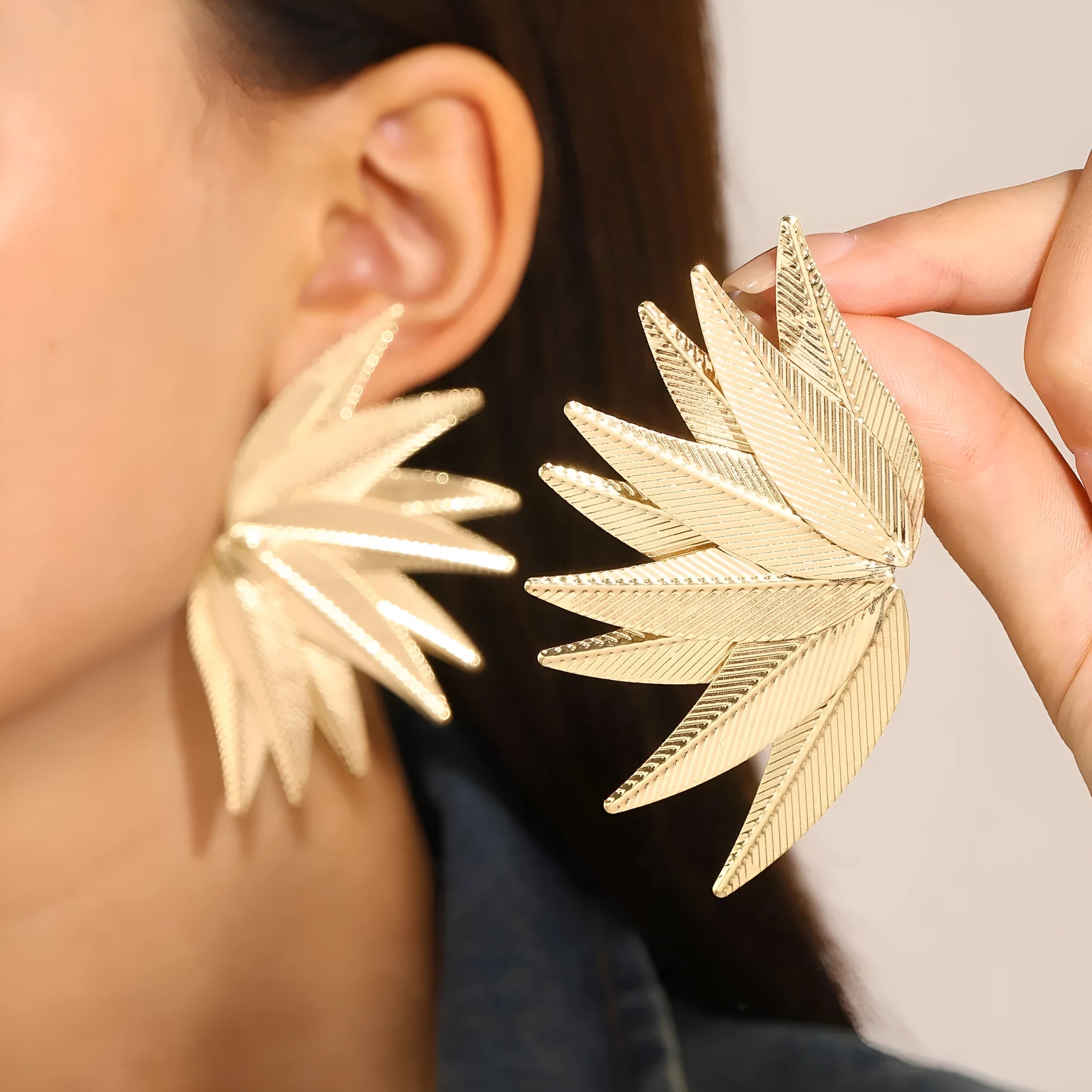 Gold and white leaves patch earrings showing detailed leaf design on alloy metal