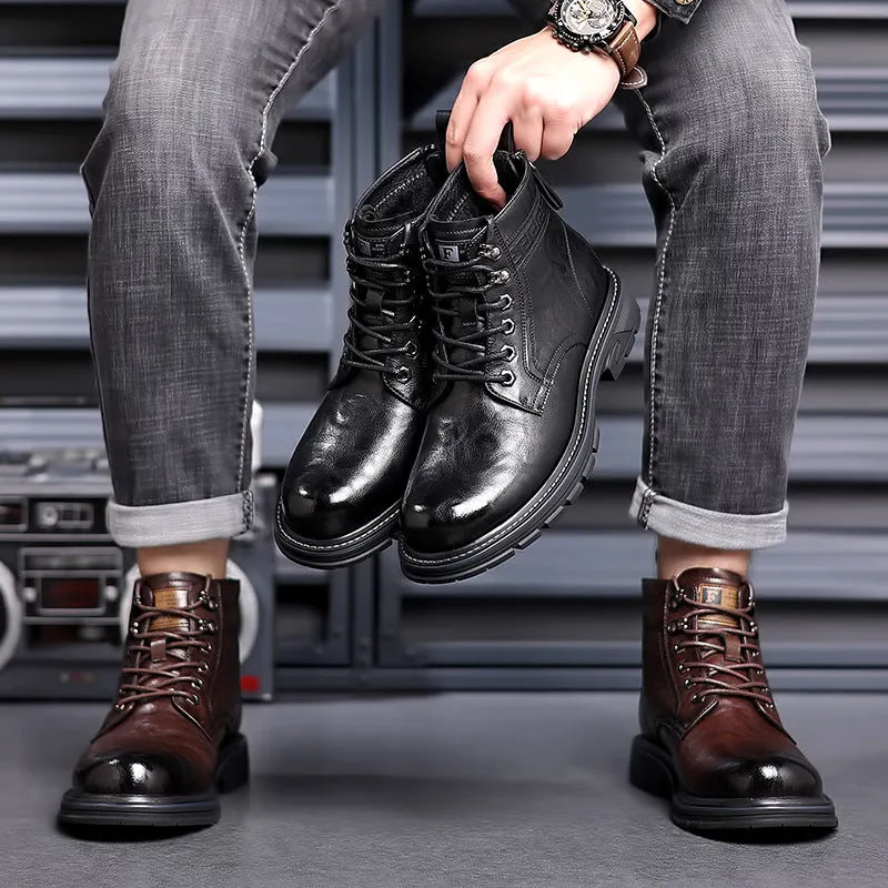 Black and brown leather Martin ankle boots with a rubber sole and visible stitching.
