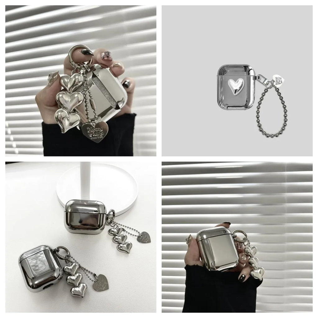 Electroplated solid colour TPU headphone case with heart pendant charms and chain for Apple earbuds.