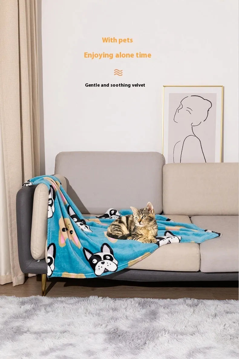Blue cartoon dog paw print pattern on a thick double-sided flannel pet blanket laid flat.