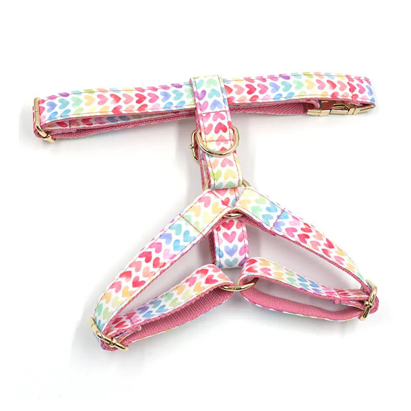 Pink dog harness with gold buckle and colourful heart-shaped crystals for small dogs