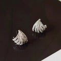 A pair of geometric zircon earrings with a line design and platinum electroplated finish.