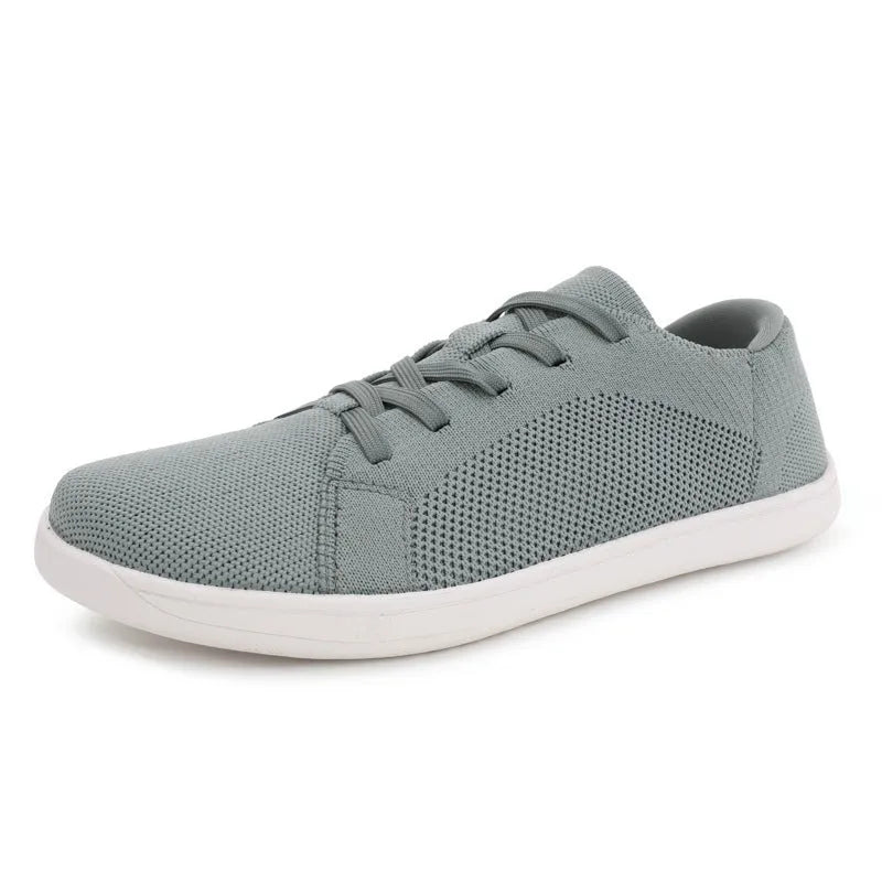 Wide toe barefoot yoga shoes with rubber sole and cotton lining in black, side view
