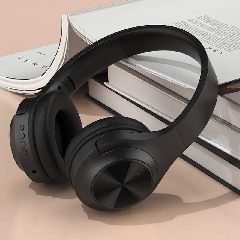 Personalised wireless Bluetooth headset in youth green colour showing head-mounted design and charging case.