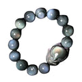 Obsidian stone bracelet with carved fox design in cartoon style, showing bead size options.