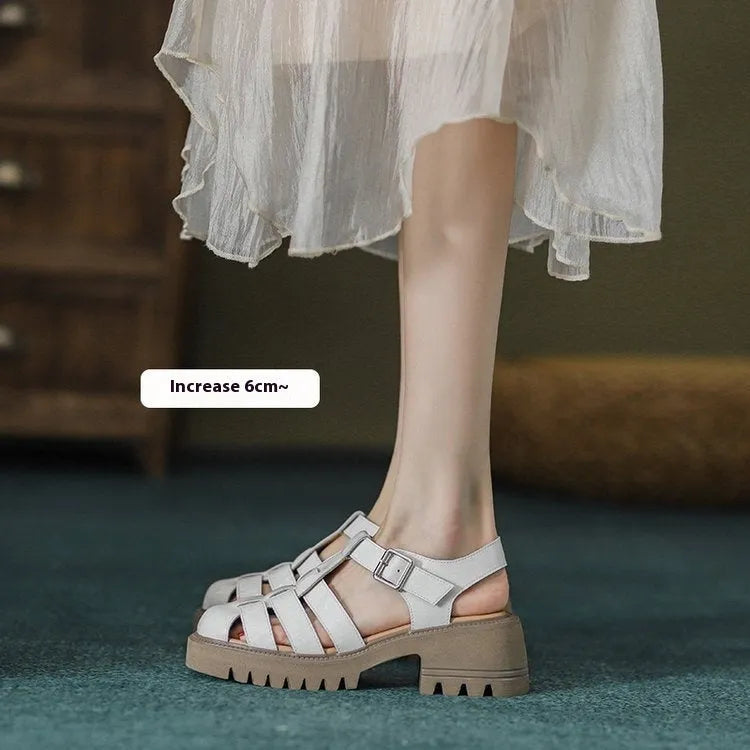 Women's black retro platform sandals with a chunky heel, closed toe, and buckle fastening.