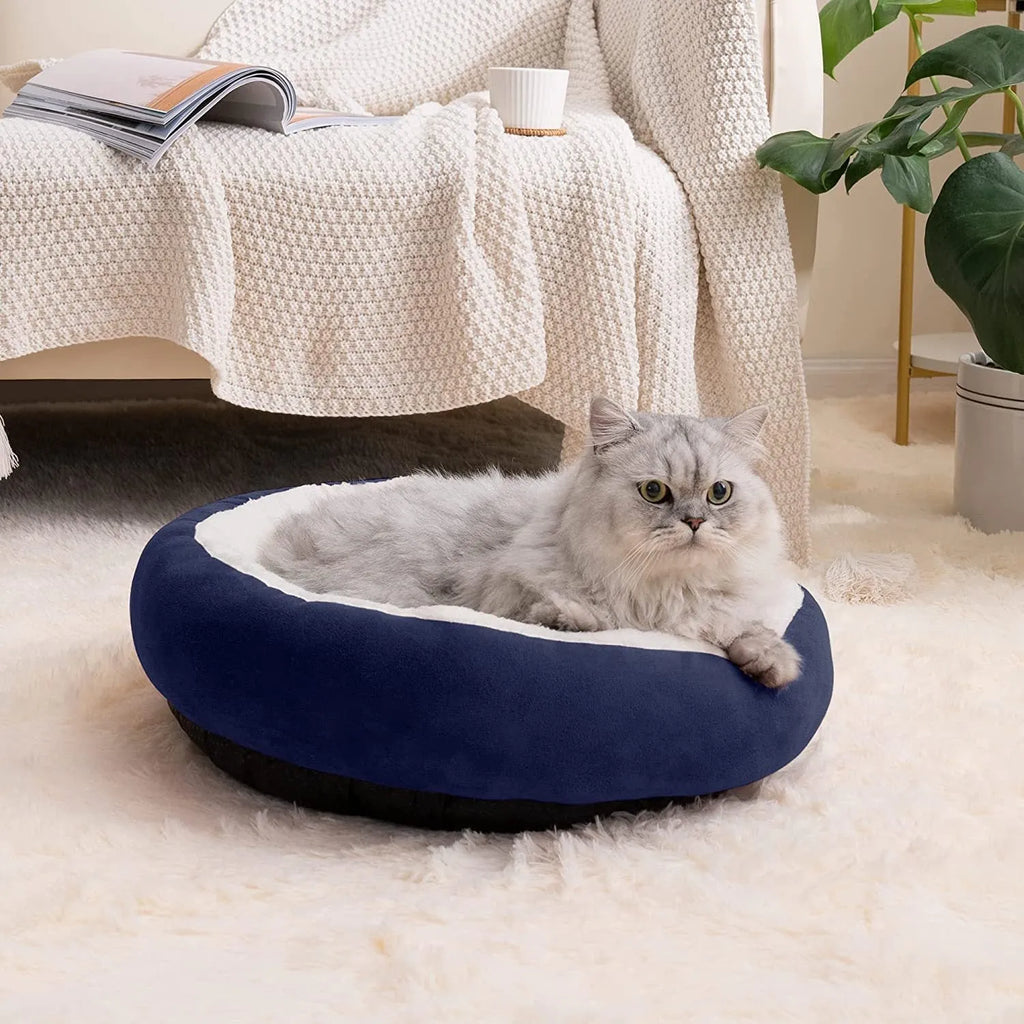 Circular soft cloth pet bed nest in blue colour showing raised edges and nesting area