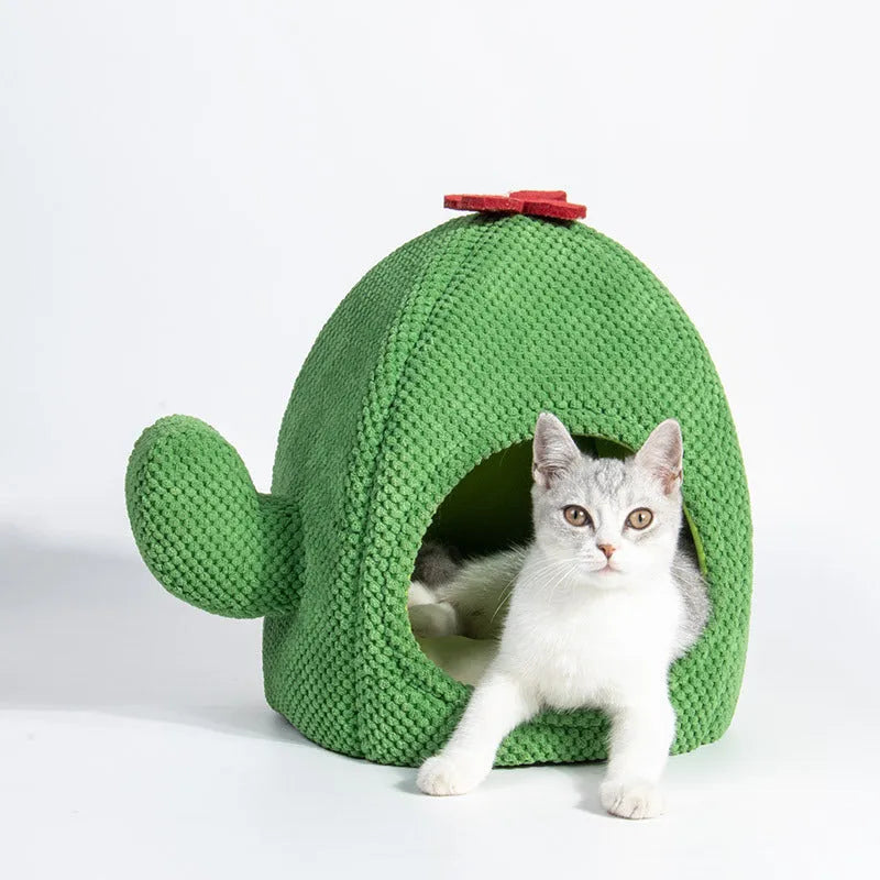Dark green cactus-shaped enclosed cat bed with a soft interior, shown with a green accent.
