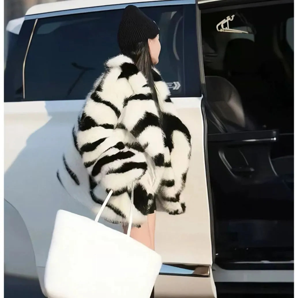 Women's zebra stripe polyester fur top with large skimmer collar and long sleeves