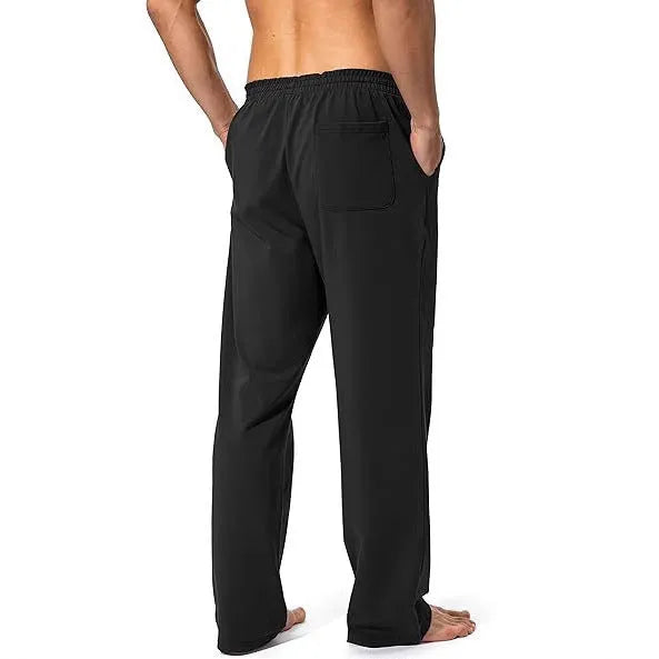 Men's loose fit quick-dry trousers in dark grey colour for sports and leisure activities