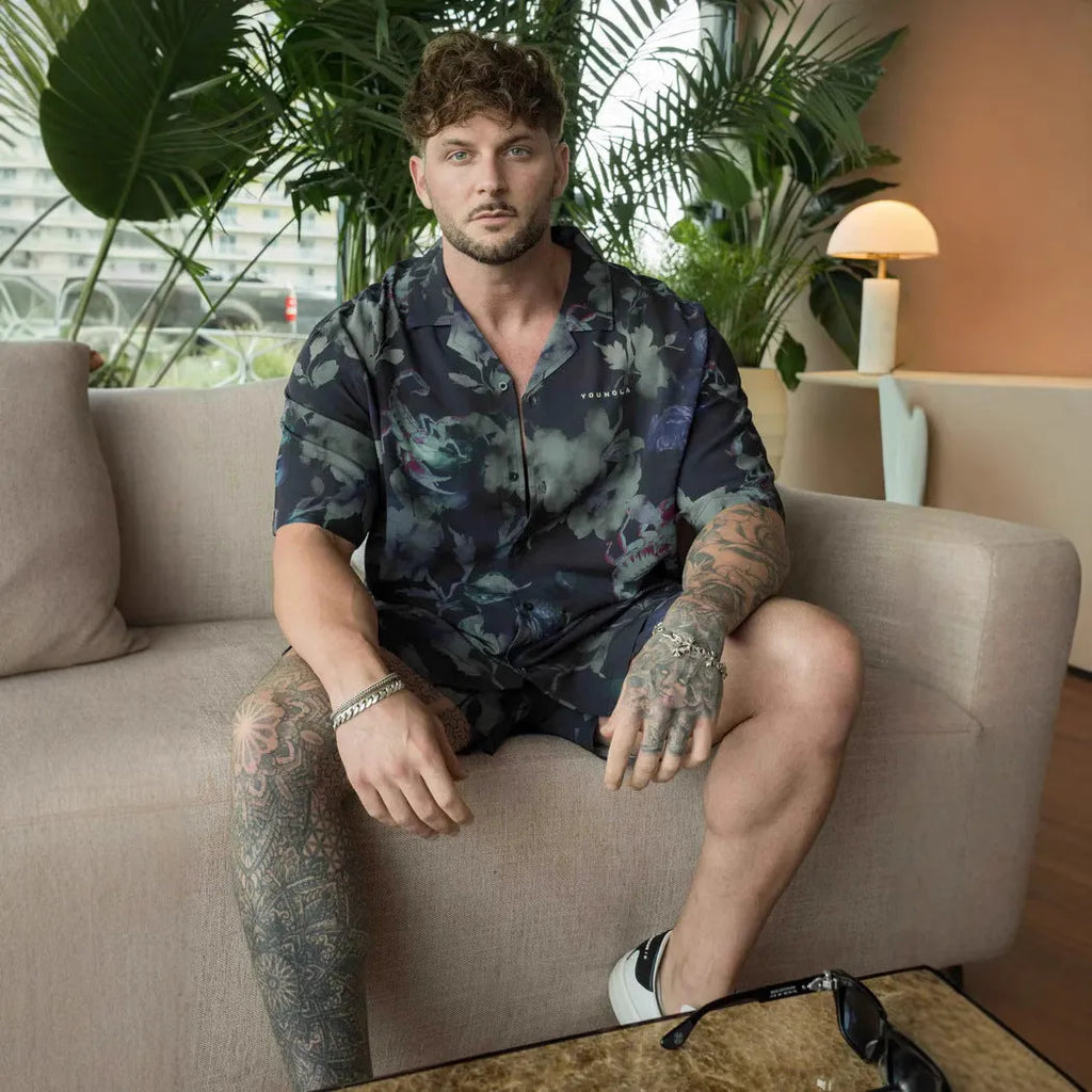 A man's loose-fitting, short-sleeve printed cardigan in a light colour for summer.