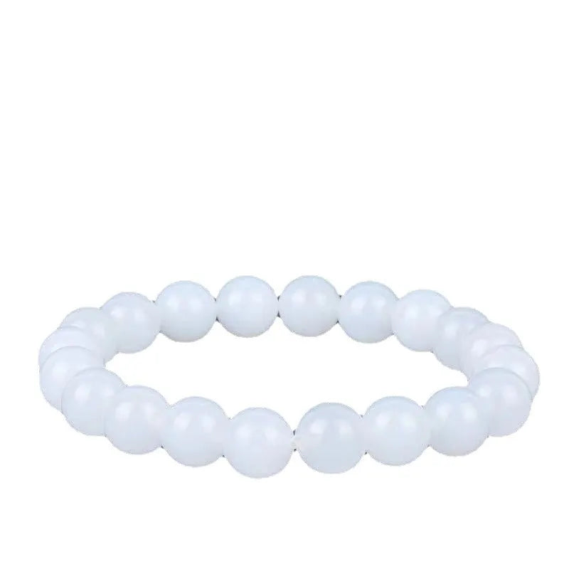 Hotan white jade goat fat round bead bracelet with 10mm Hetian jade beads on a neutral background