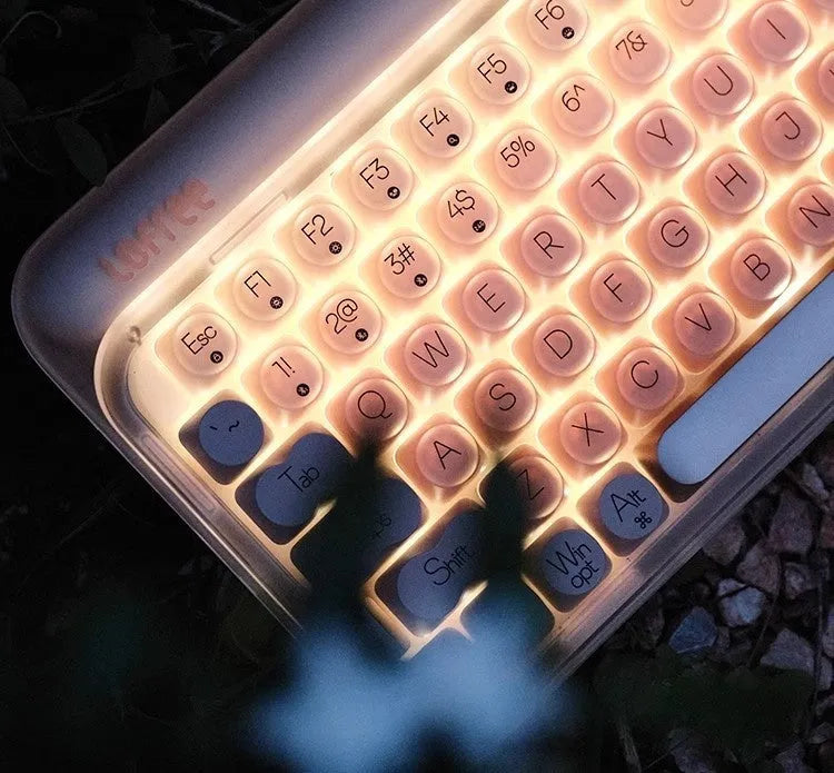 Liquid foundation colour wireless mechanical keyboard bundle with mouse, light, and Bluetooth calculator on a desk