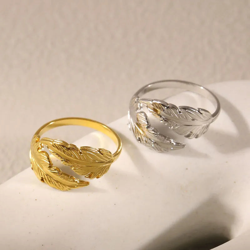 Adjustable stainless steel feather ring with electroplated silver or gold finish