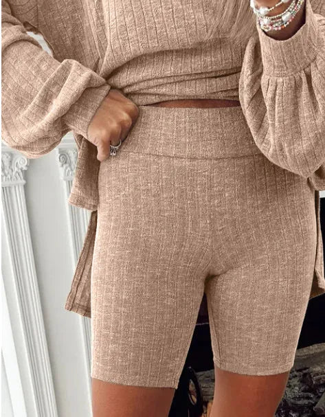 Dark khaki ribbed lantern sleeve sweater and motorcycle knit shorts set on display