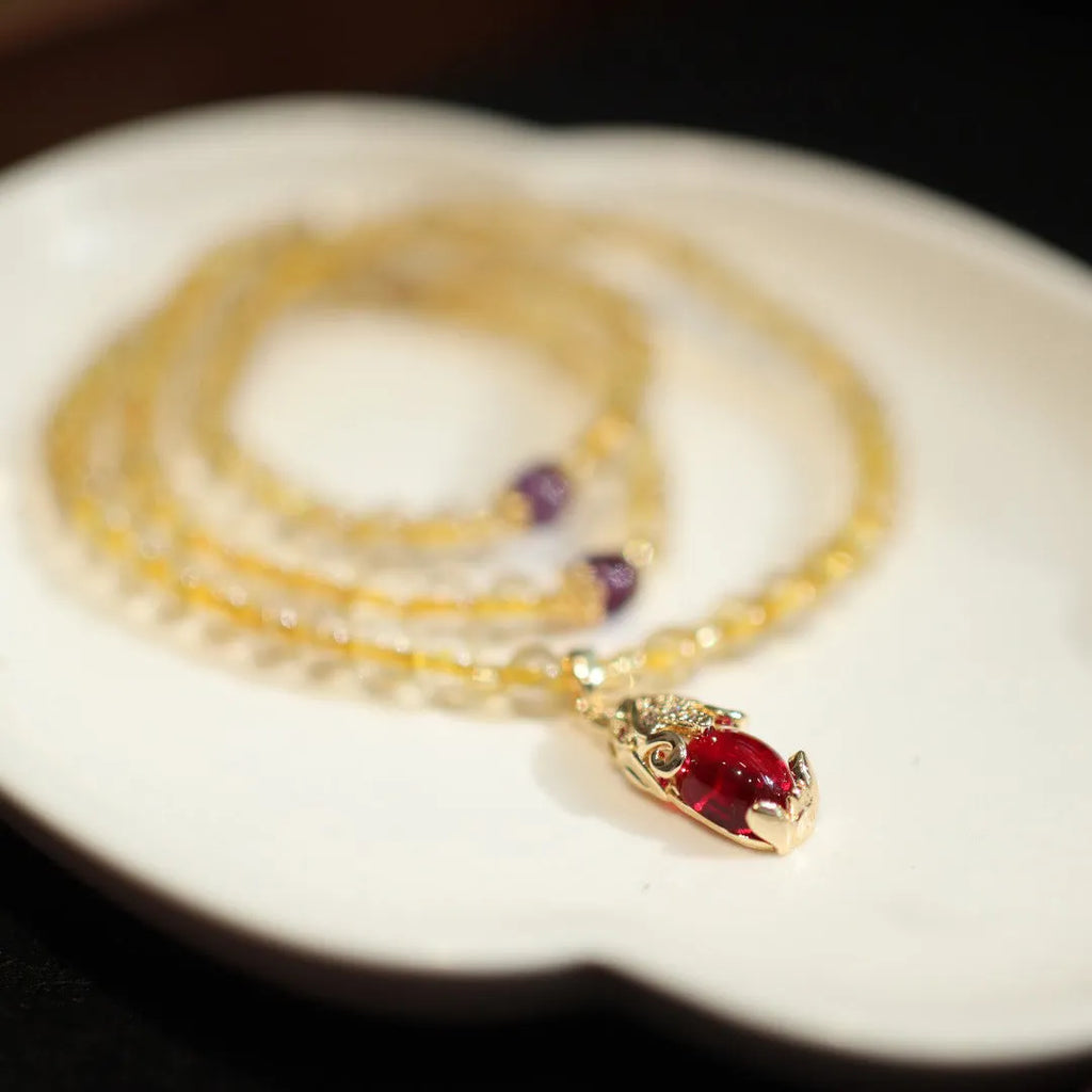 Brazilian rutilated quartz bracelet with Chinese style three-ring gold design in natural gold colour