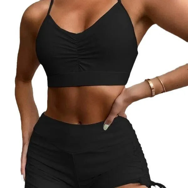 Purple and black women's high waisted bikini swimsuit with side splits.