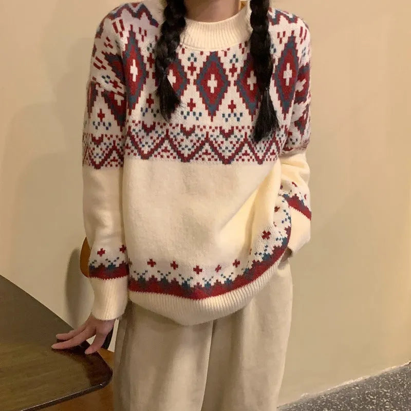 Loose red and white striped retro pullover knitted top with long sleeves on a hanger.