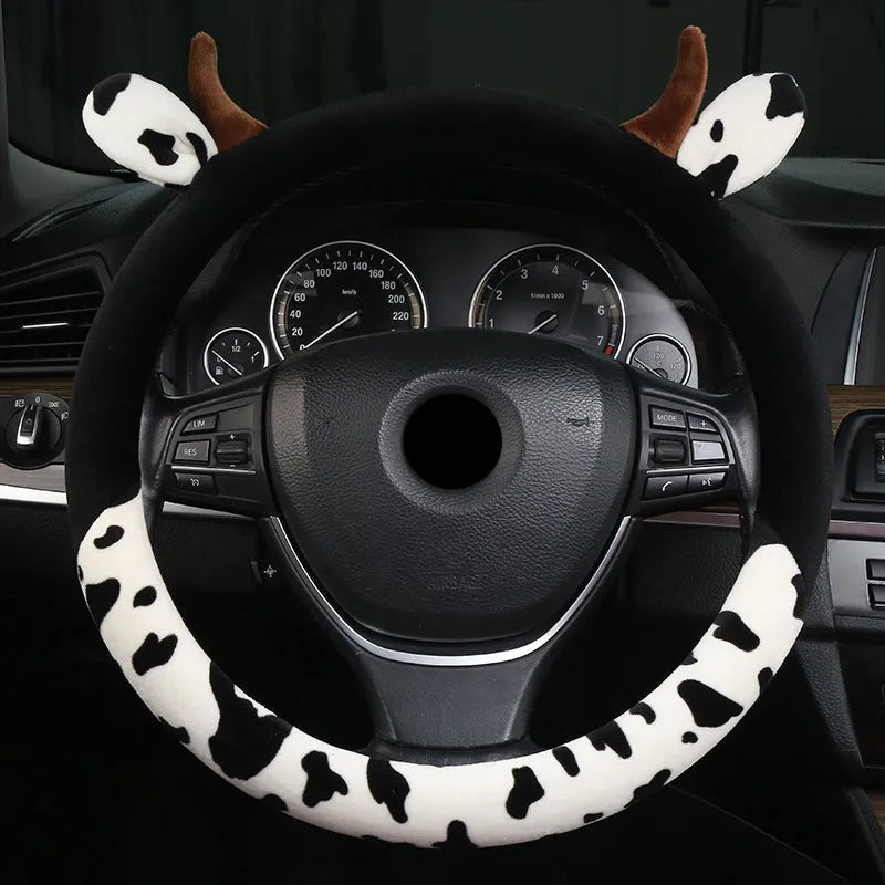 Black plush steering wheel cover with protective handle on car steering wheel
