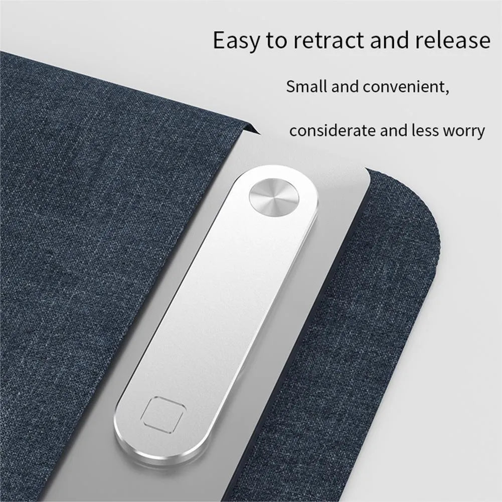 Black aluminium magnetic phone holder clipped to side of a silver laptop.