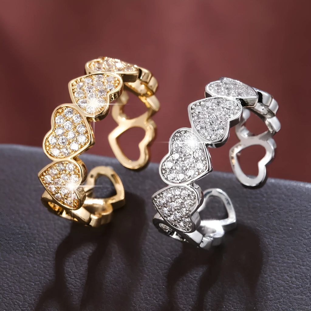 Geometric gold couples ring with heart engraving on an adjustable open band