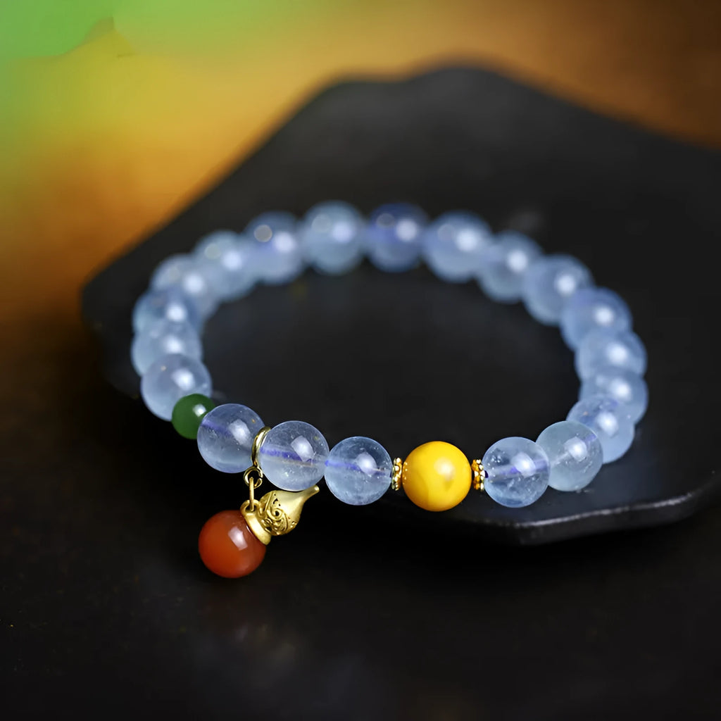 Women's geometric bracelet with blue 8mm aquamarine beads and ethnic retro design.