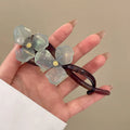 Retro flower bobby pin hair clip with acrylic petals in blue, light blue, beige, or pink colours
