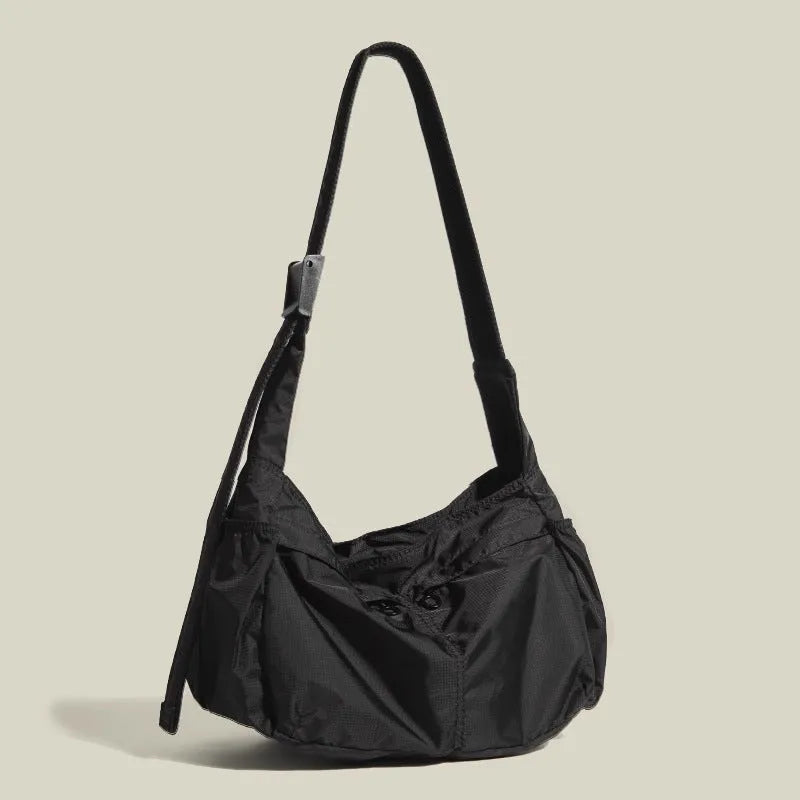 Black nylon waterproof sports style messenger bag with horizontal square design and shoulder strap