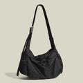 Black nylon waterproof sports style messenger bag with horizontal square design and shoulder strap