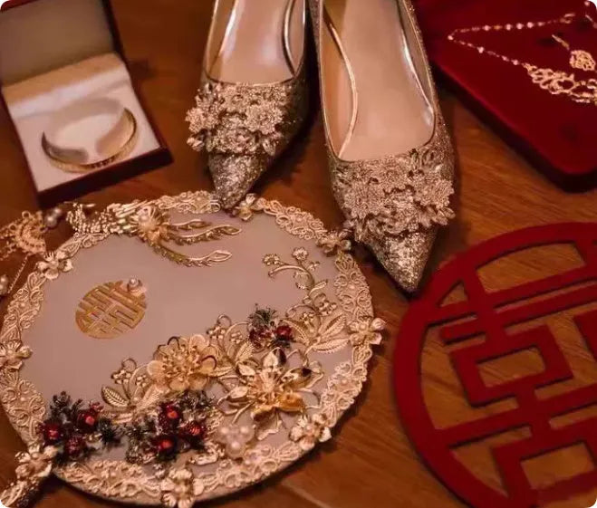 Champagne coloured pointed toe bridal shoes with rhinestone floral pattern on a fine heel.