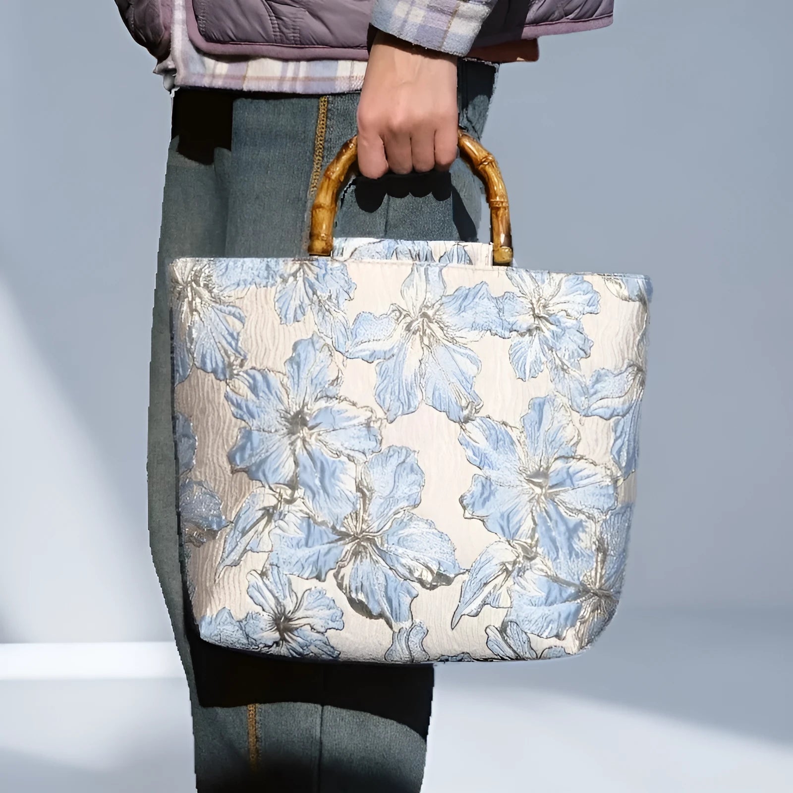 Light blue canvas shoulder bag with gold floral pattern showing 30x30x10 cm dimensions and double straps