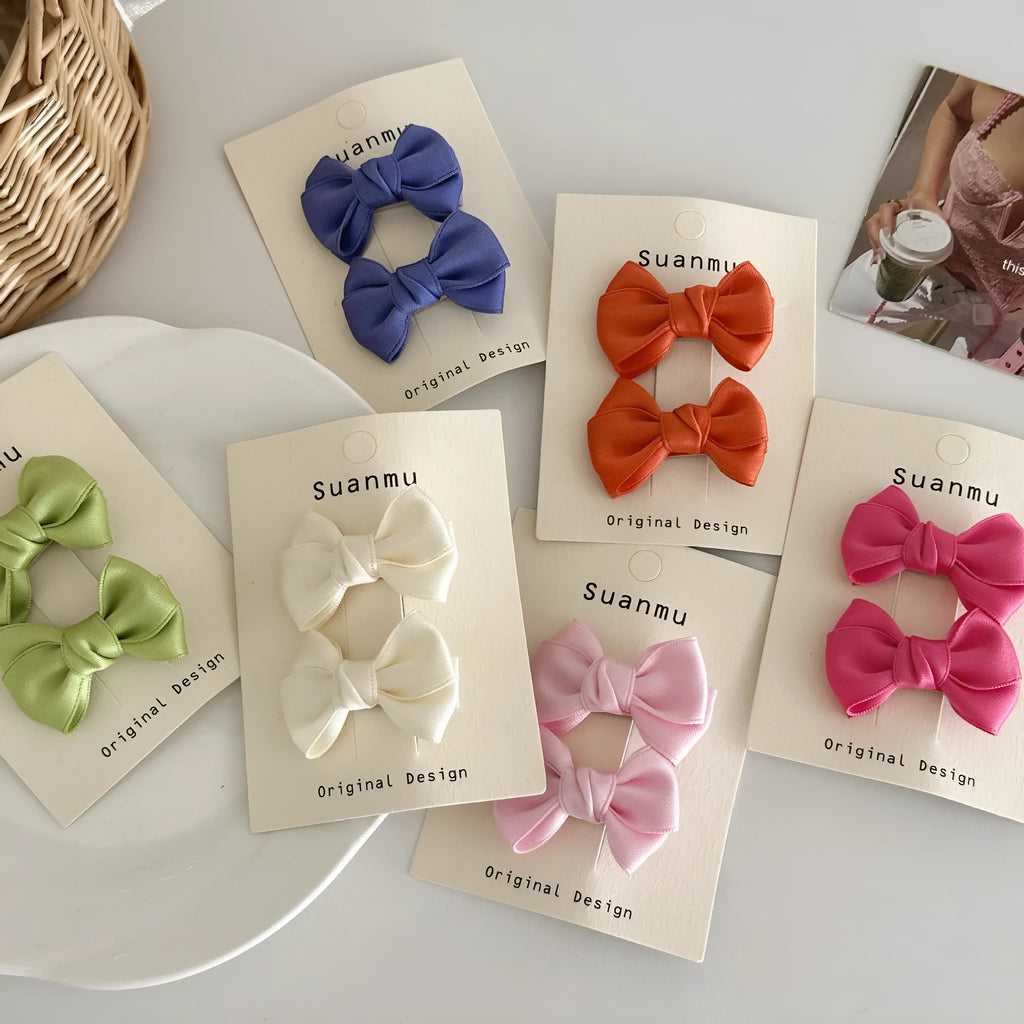 Fabric bowknot children's hair clip in cream colour with 6cm bow size on side clip