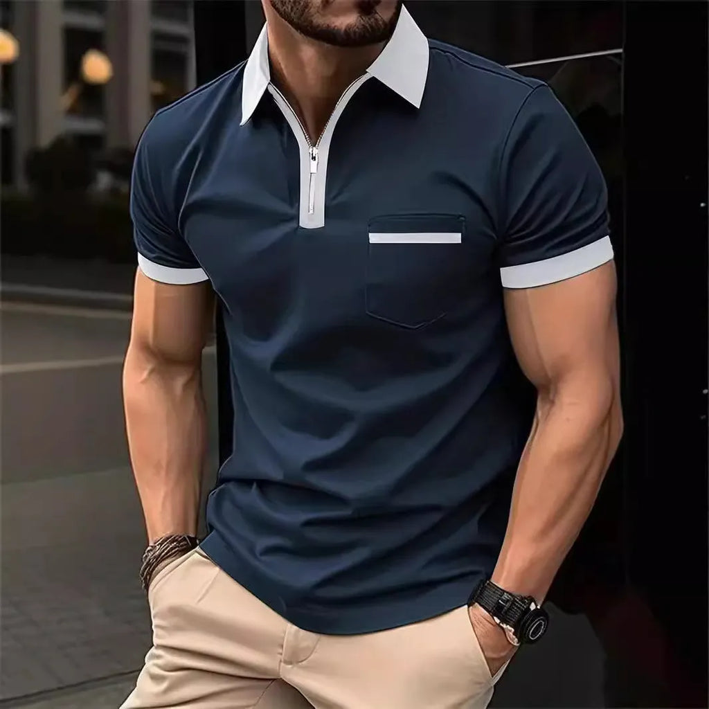 Man wearing a loose fit casual short sleeve shirt with a chest pocket and zipper decoration.