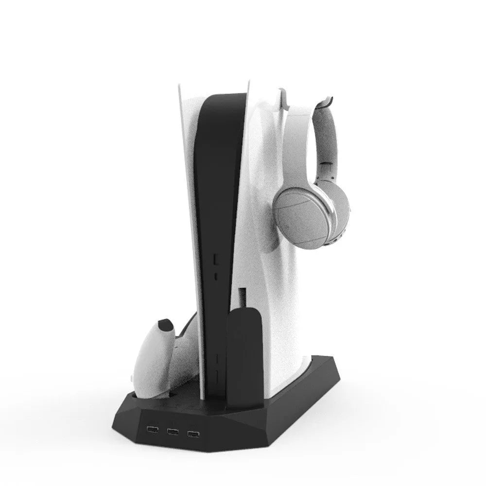 PS5 vertical charging dock stand with cooling fan in black, showing two controllers charging and a headset hanging on hook.