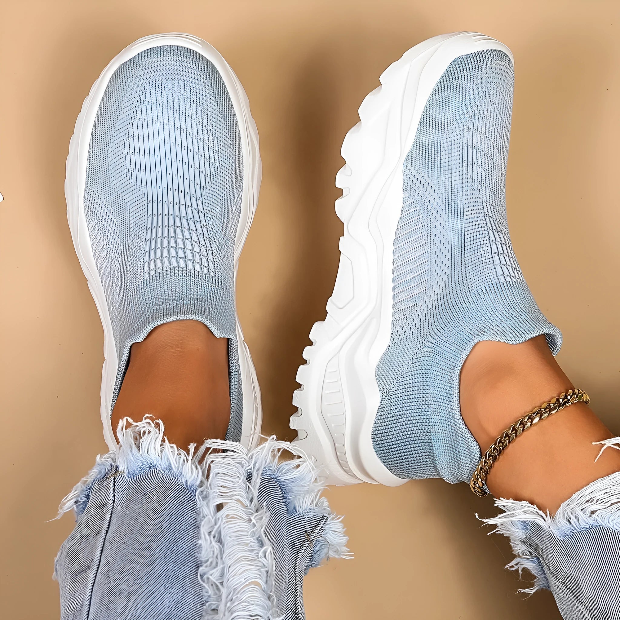 Light blue women's mesh slip-on sports shoes with woven design and round toe