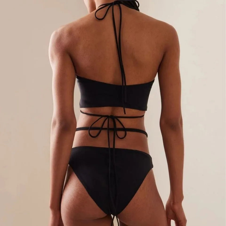 Women's black bikini swimsuit with split lace-up front design and briefs-style bottom