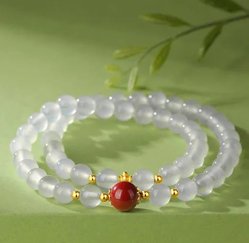 White agate women's bracelet with geometric design and Jequirity Bean Cinnabar detailing