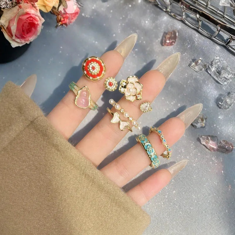 Close-up of a vintage-style adjustable copper ring with a gourd and floral design in a zircon inlaid finish.