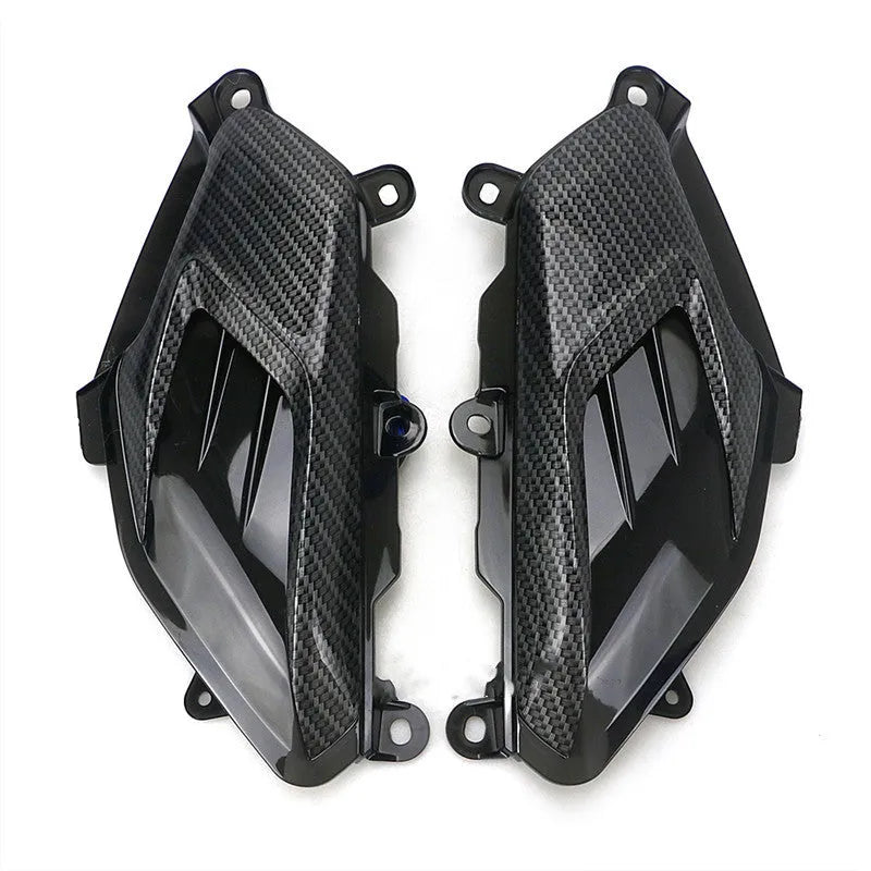 Pair of aftermarket side lamps for Yamaha NMAX motorbike with carbon fibre design and LED light.