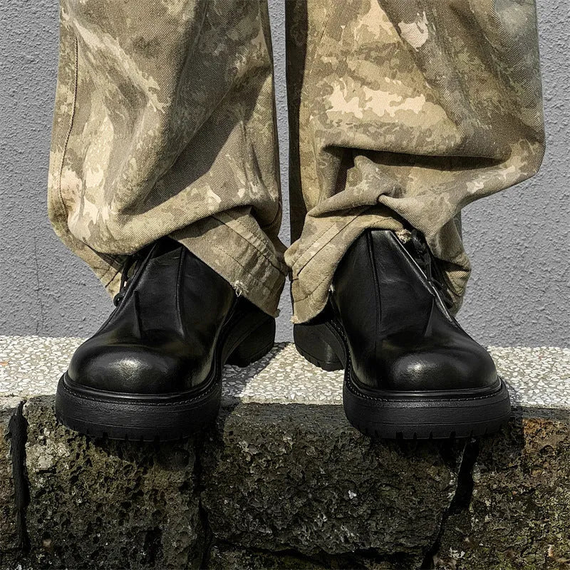 Black low-top platform leather shoes with round toe and rubber sole