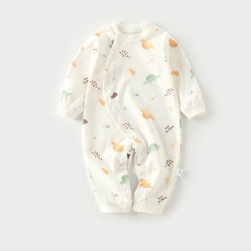 Cotton baby pajamas in cartoon dragon print for a newborn infant.