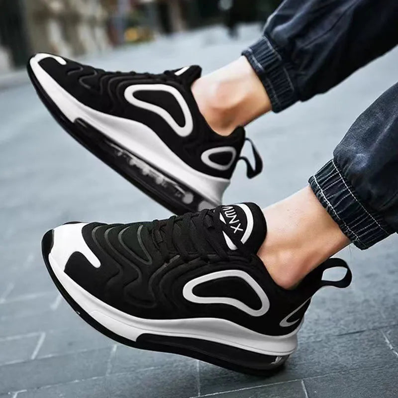 Men's black casual sneakers with lace-up front and a thick air cushion sole.