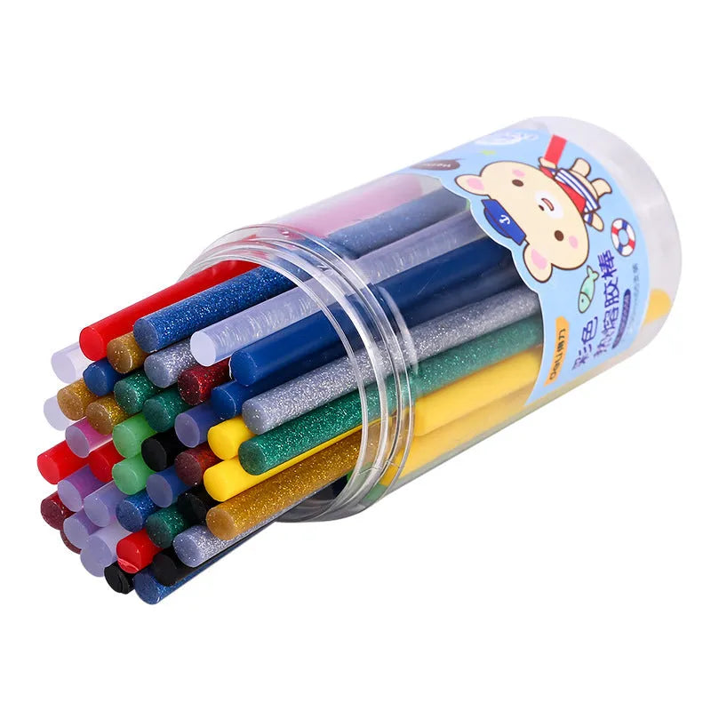 Pack of 55 clear hot melt glue sticks with 7mm diameter next to a glue gun.
